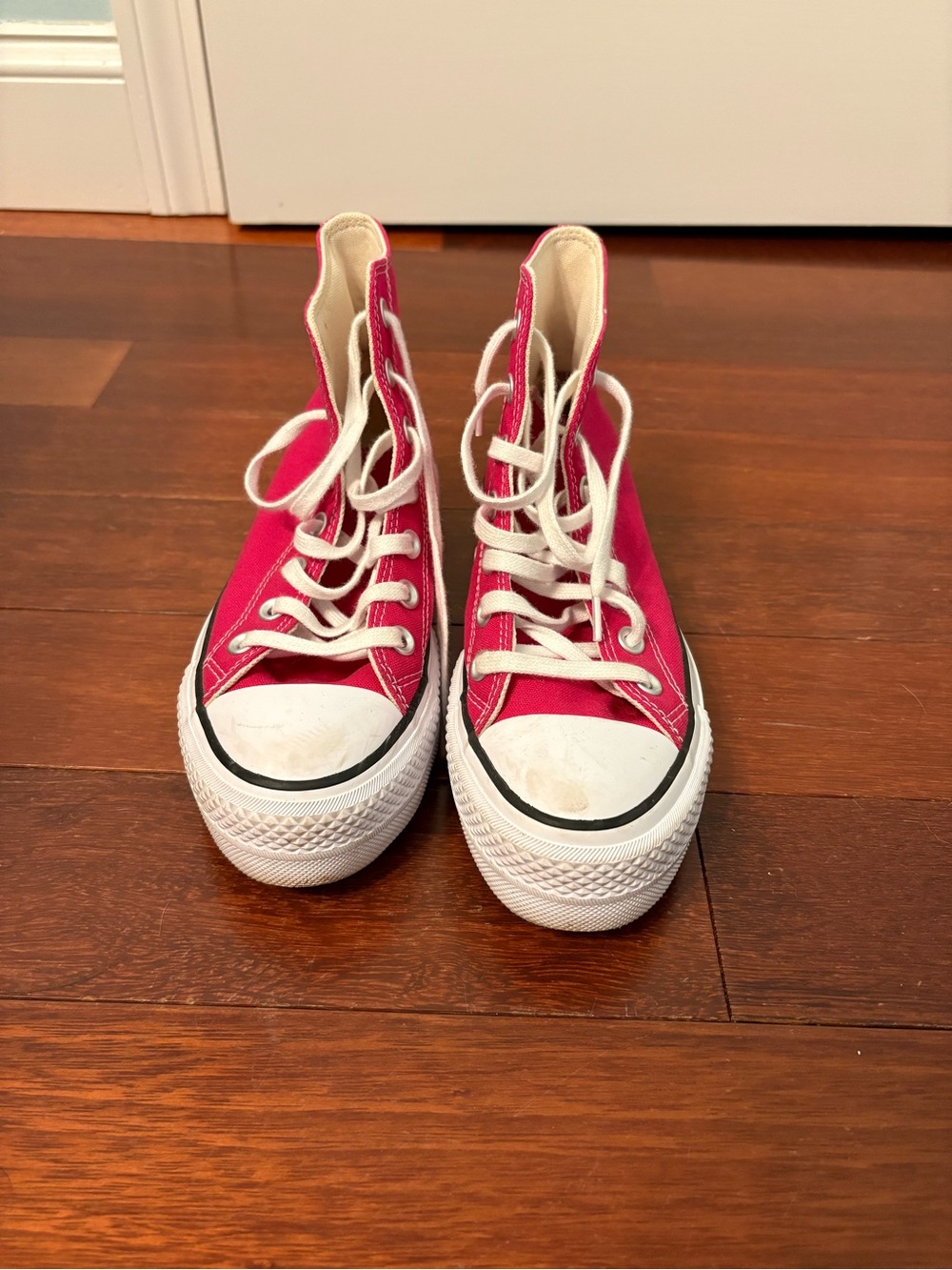 Woman’s pink platform converse high tops